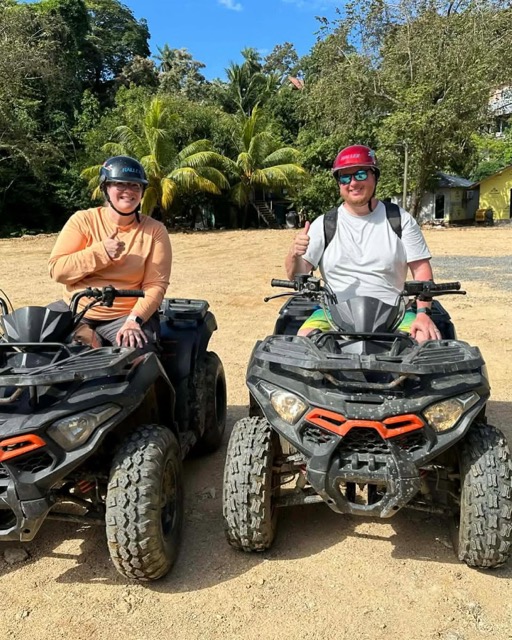 Two guests ready to ride ATVs