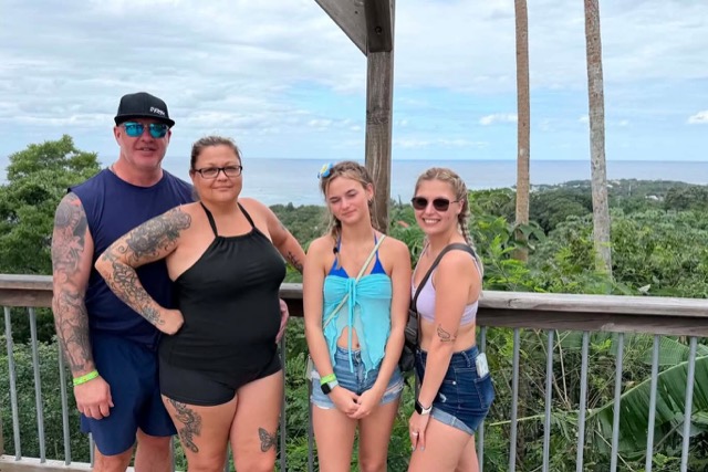 Family photo at a jungle lookout deck